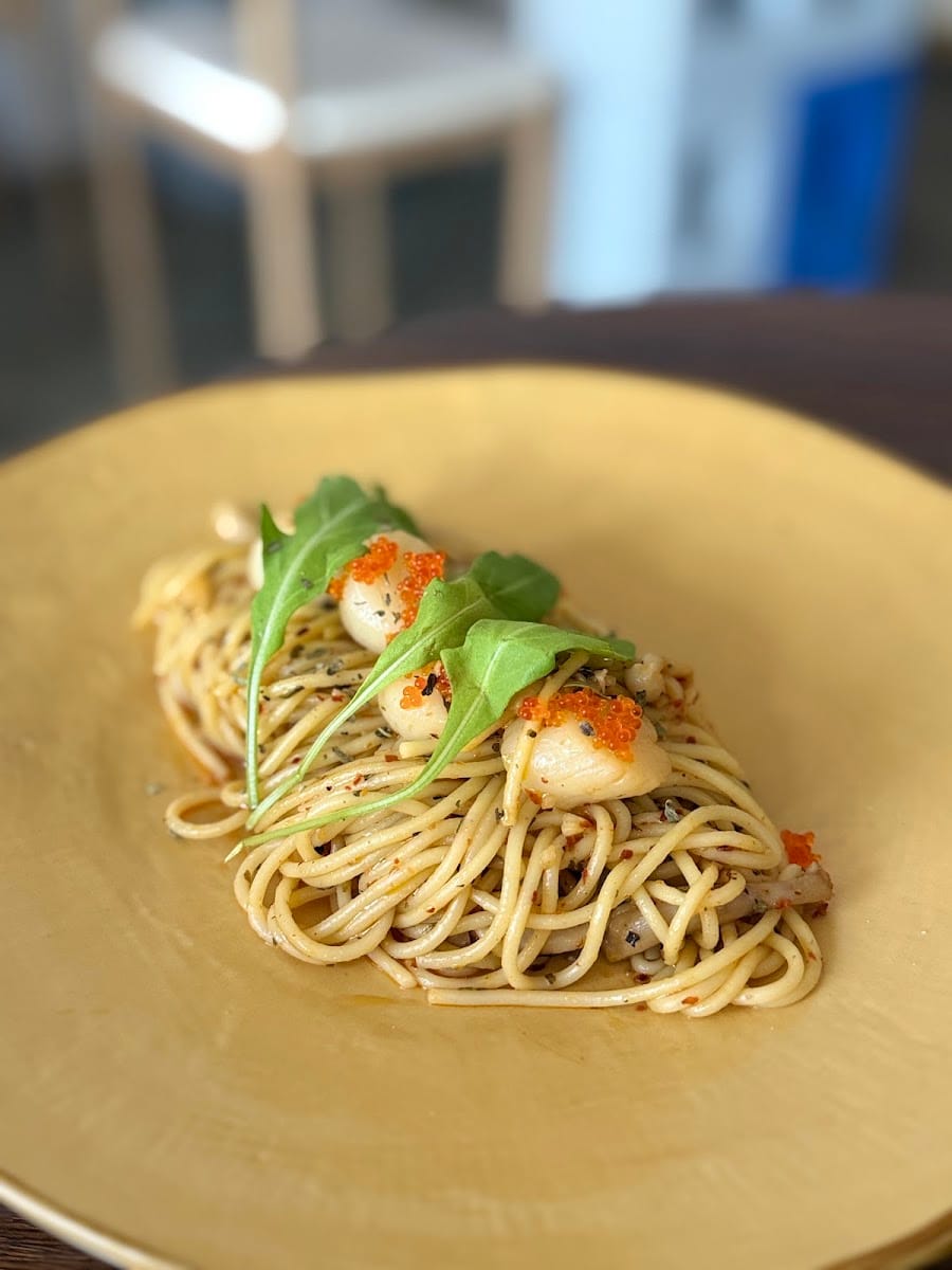 Scallop and roe pasta plated at The Blue Door Coffee House